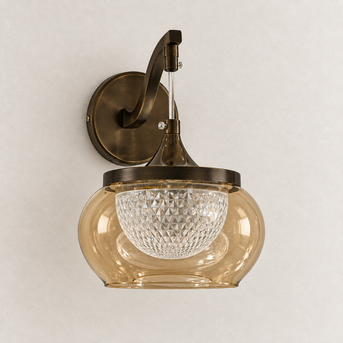 Amber glass hanging bowl wall light with patterned acrylic inner bowl and sweeping wall arm, switched off