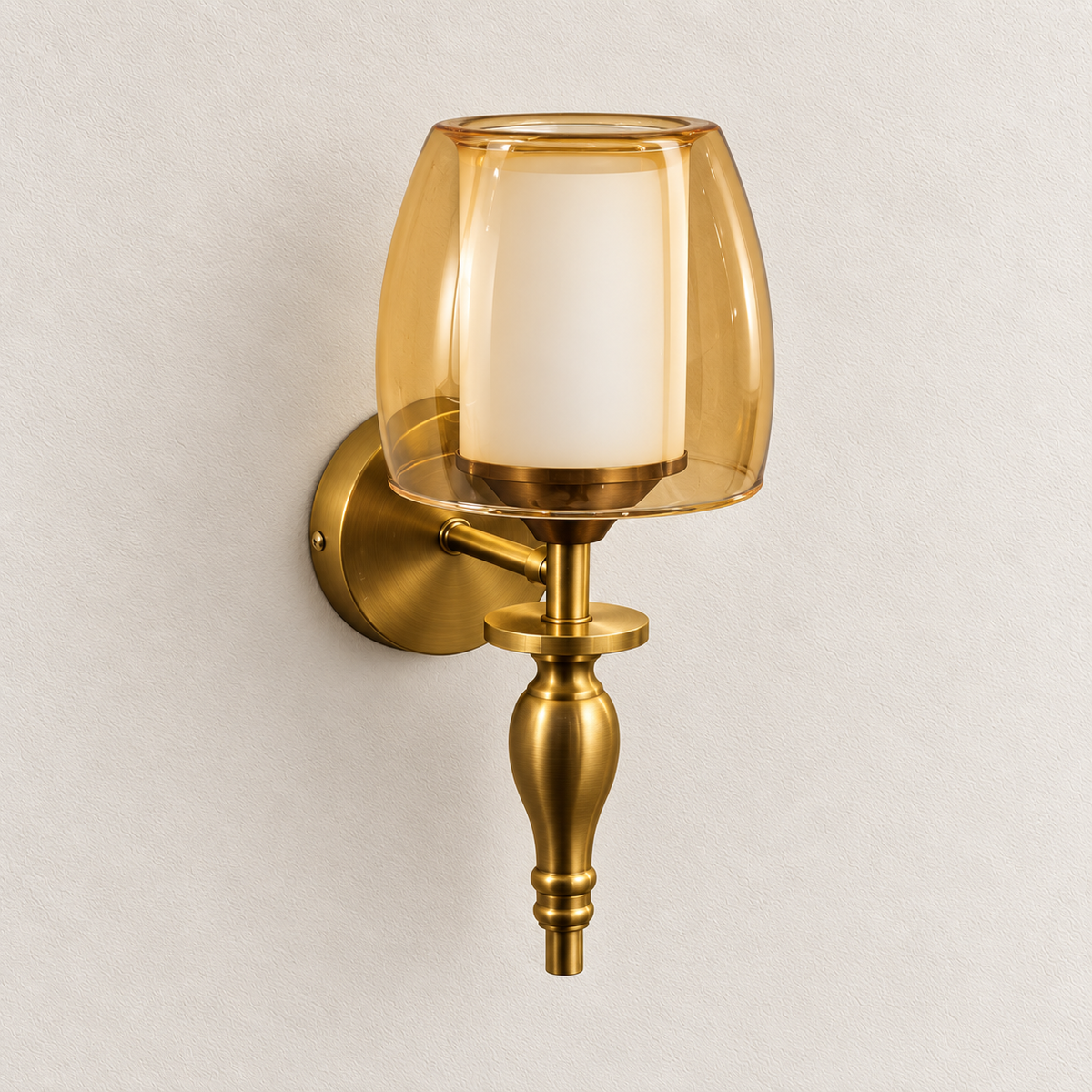 Amber and frosted glass wall light with curved outer shade, sculpted lower finial and round backplate, switched off