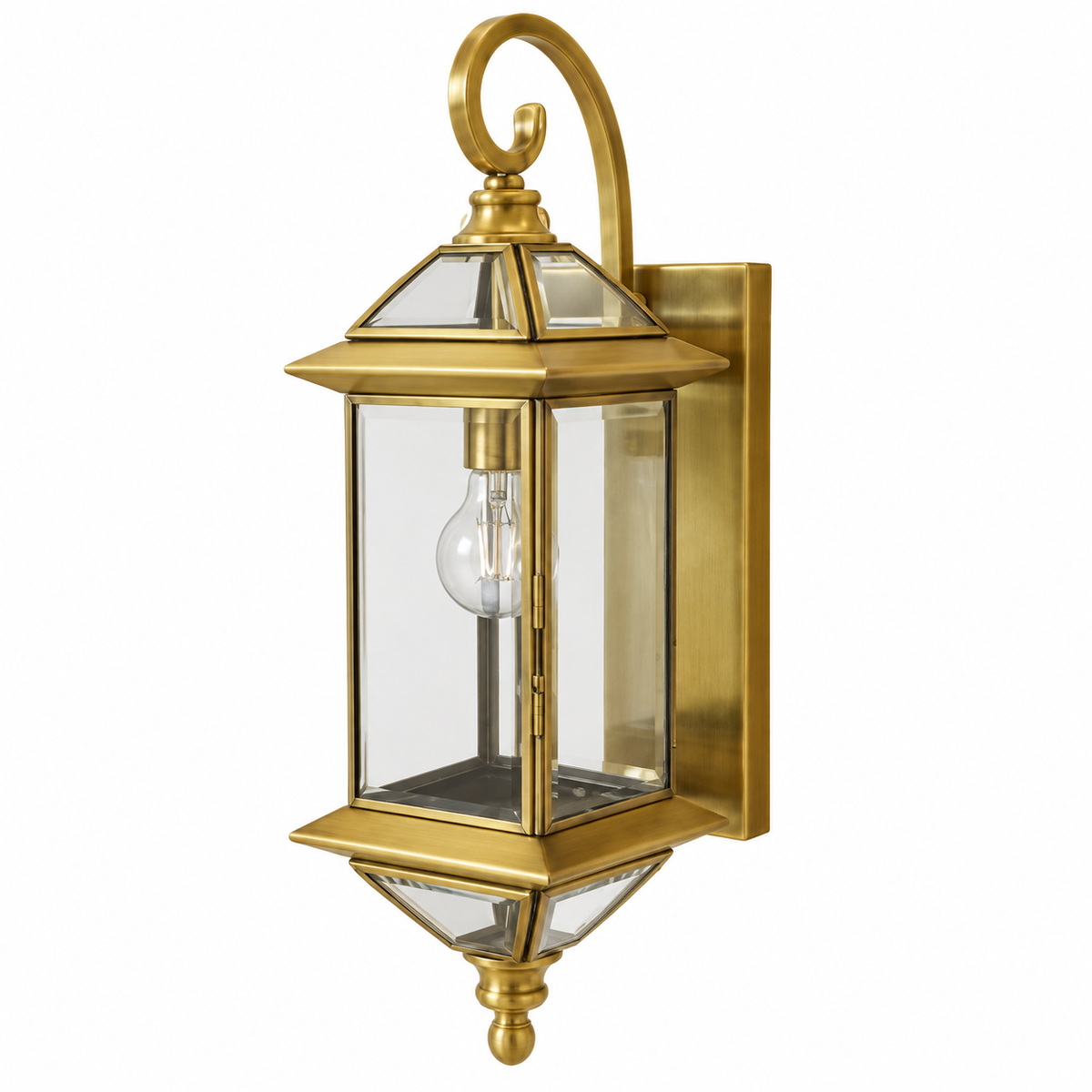 Brass lantern wall light with clear glass panels, a curled upper arm and lower finial, switched off against a white background