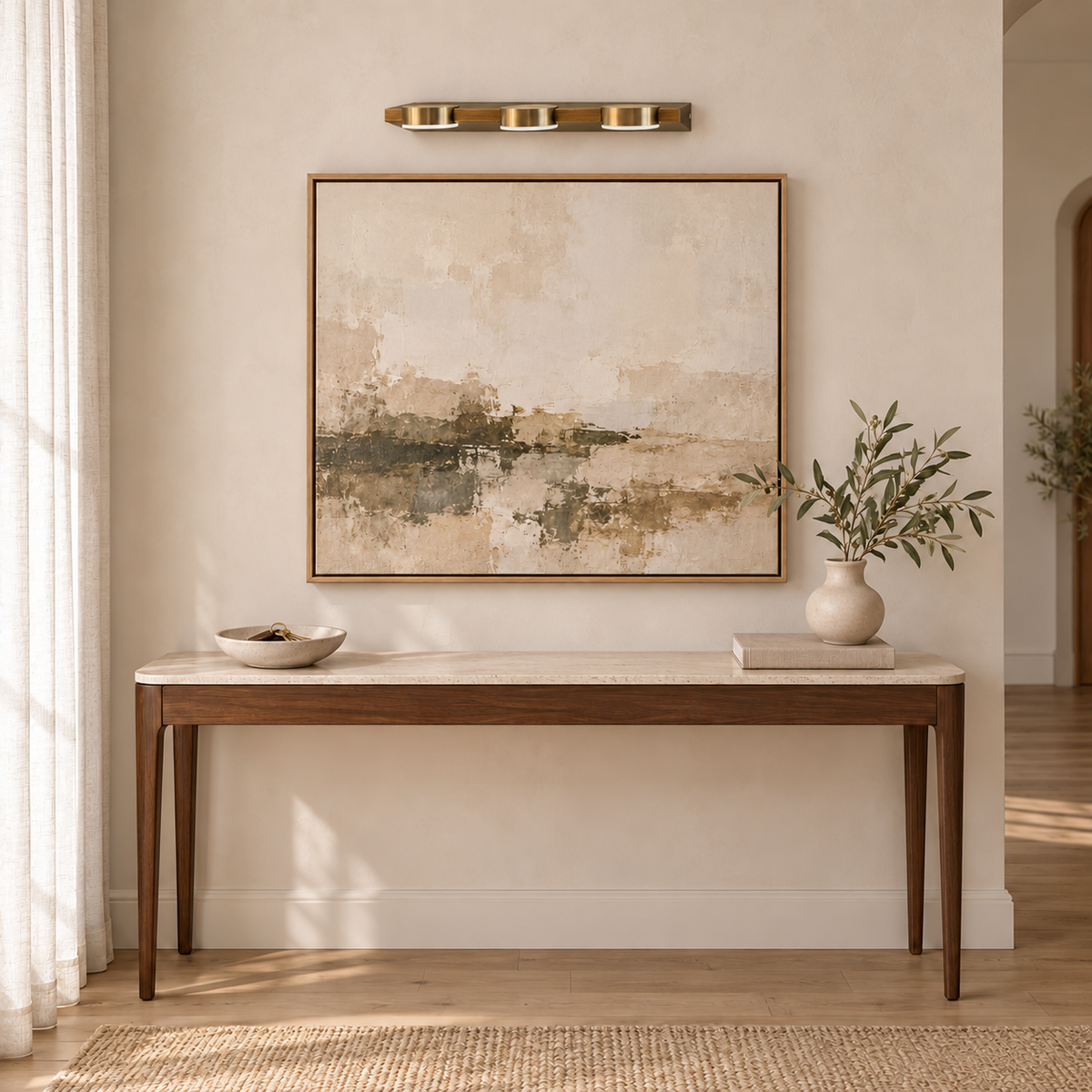 Gold-Toned 3-Puck Picture Light, 460 mm installed in a residential interior in daylight, light off