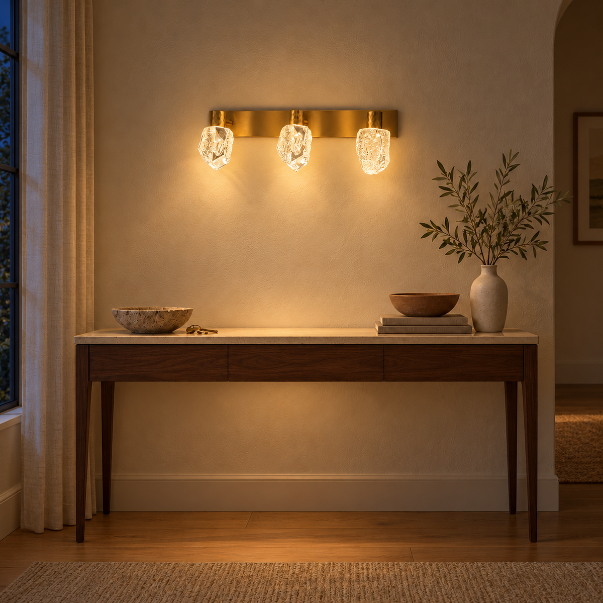 Gold Faceted Acrylic 3-Head Picture Light, 460 mm illuminated in the same residential interior at night