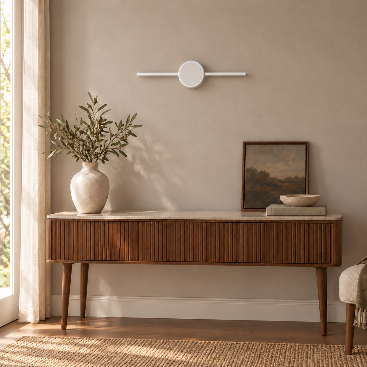 White Halo-Disc Picture Light, 400 mm installed in a residential interior in daylight, light off