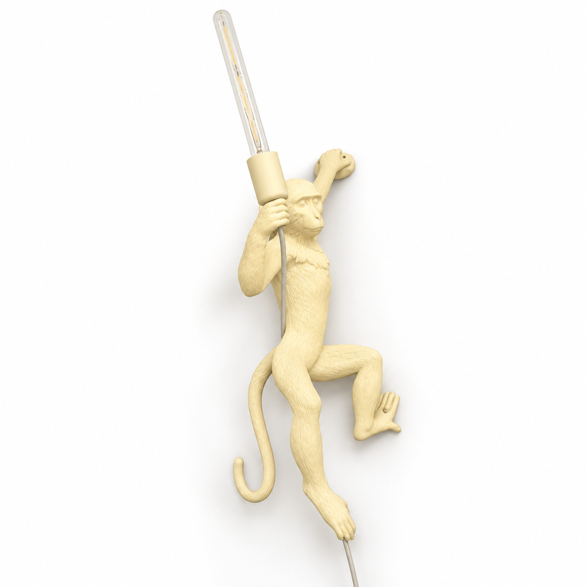 Climbing monkey sculptural wall light, switched off on a white studio background.