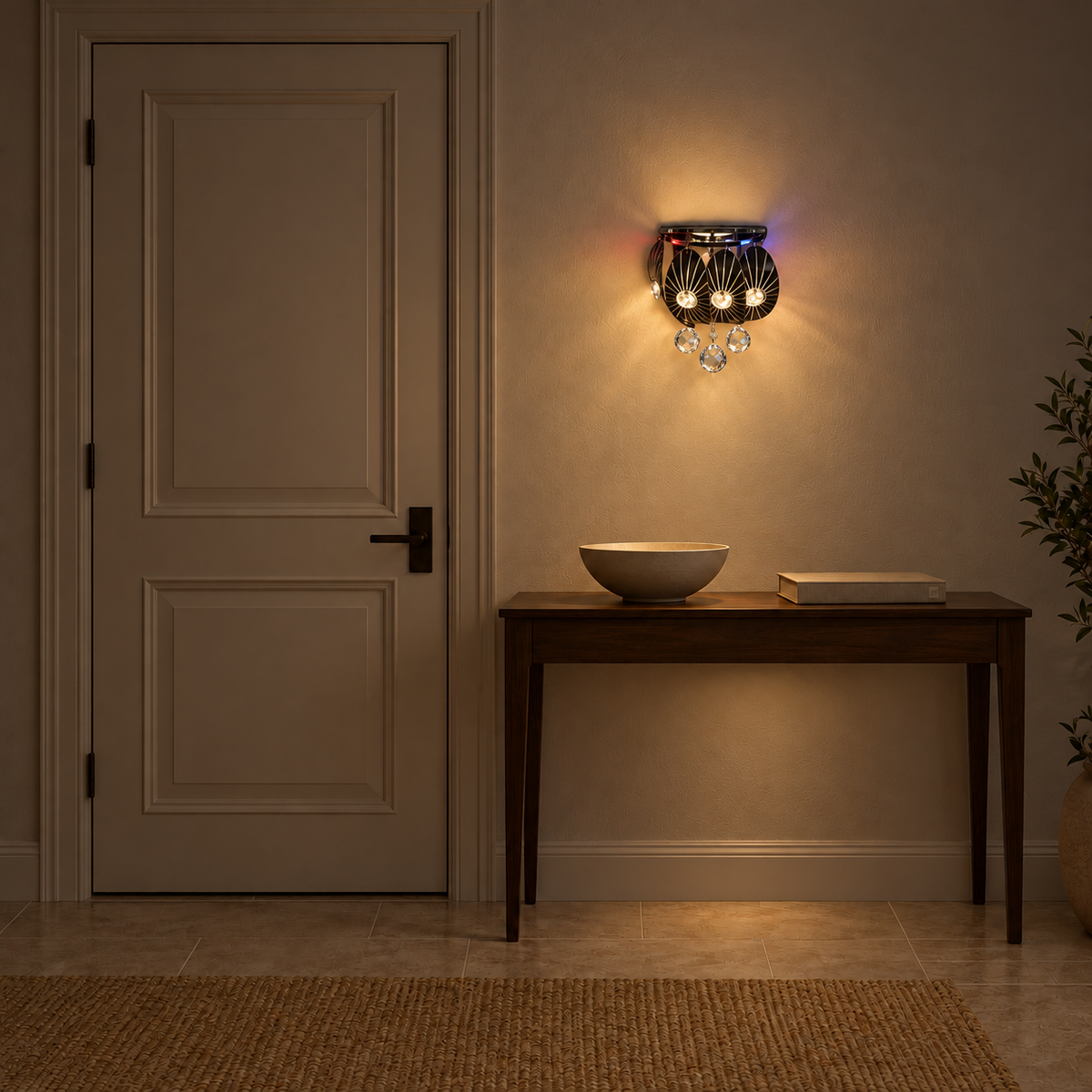 Crystal cascade crown wall light, illuminated in a nighttime interior setting.