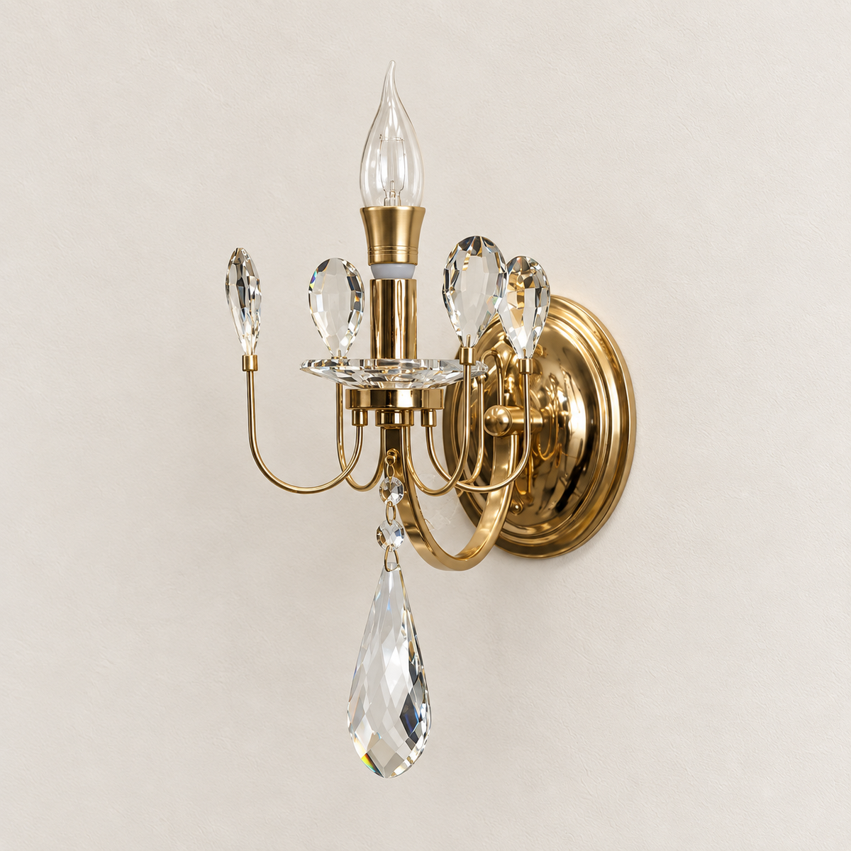Candle-style wall light with clear crystal petal accents and a long teardrop pendant, switched off