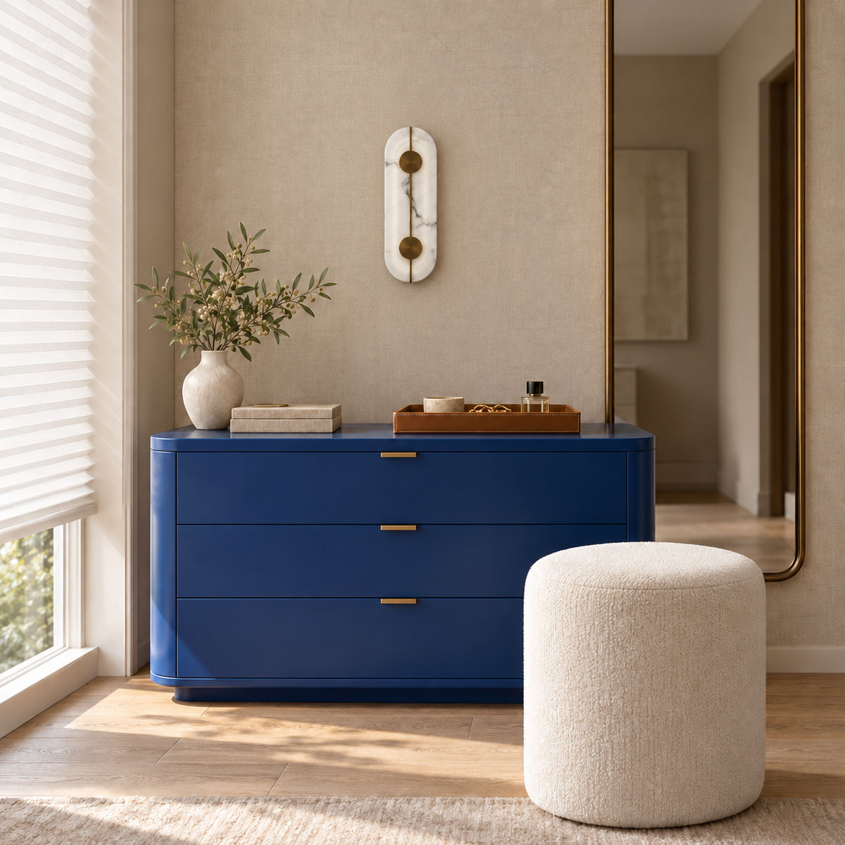 Stone-effect capsule wall light above a blue chest of drawers in daylight, switched off