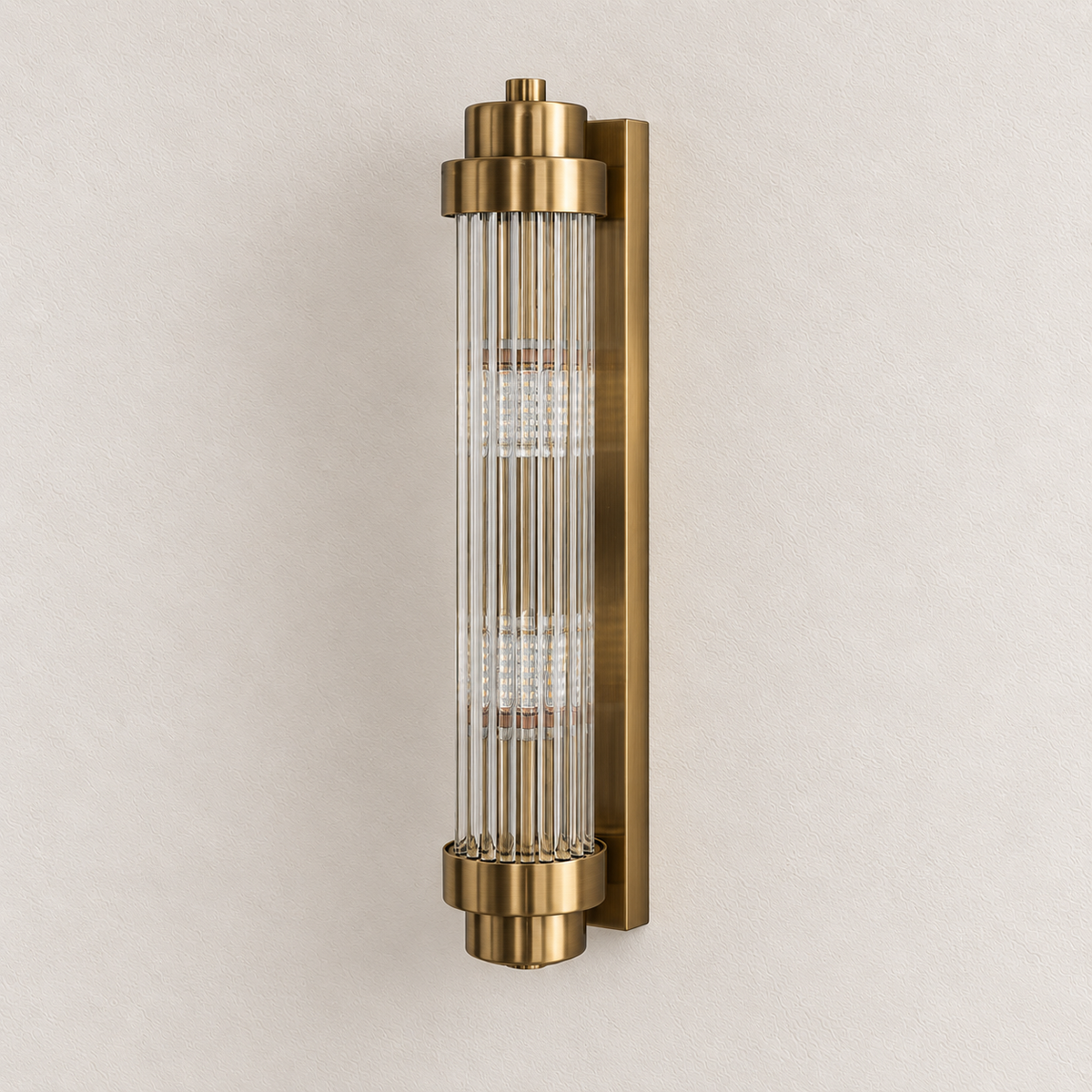 Clear glass rod wall light with stepped metallic end caps and a rectangular backplate, switched off