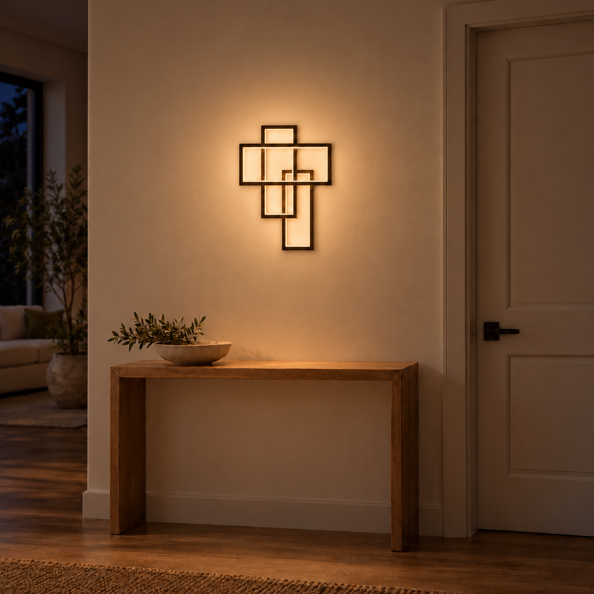 Coffee-coloured wall light with three overlapping open rectangular frames, illuminated in an interior setting at night.