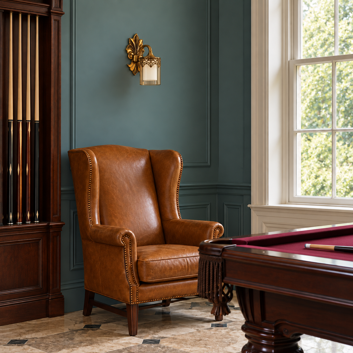 Leaf-Backplate Filigree Glass Wall Light above a leather armchair beside a billiard table in daylight, switched off