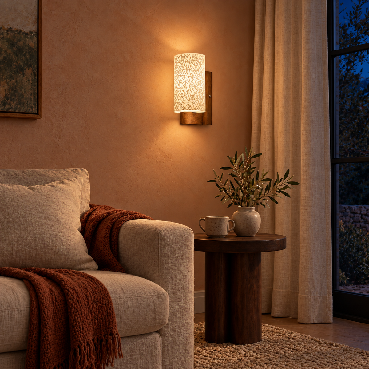 Crosshatch Glass Wood Wall Light above a round side table beside a pale sofa at night, illuminated