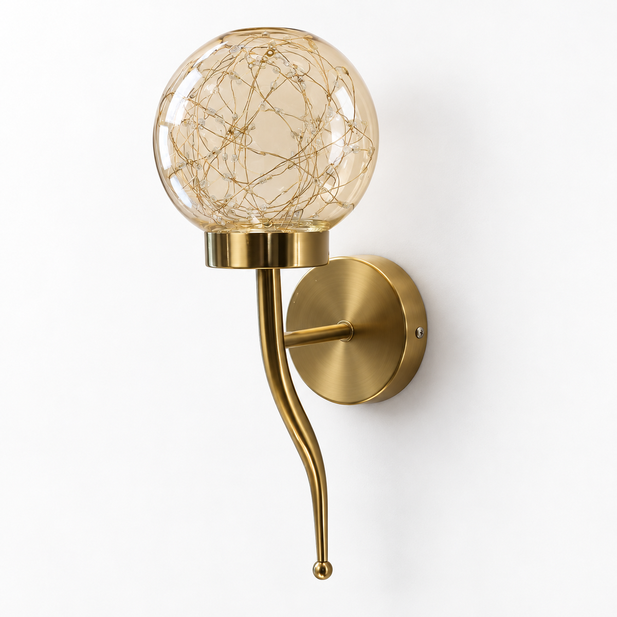 Amber glass globe wall light with fine internal light wires, a curved lower stem and round backplate, switched off on a white background.