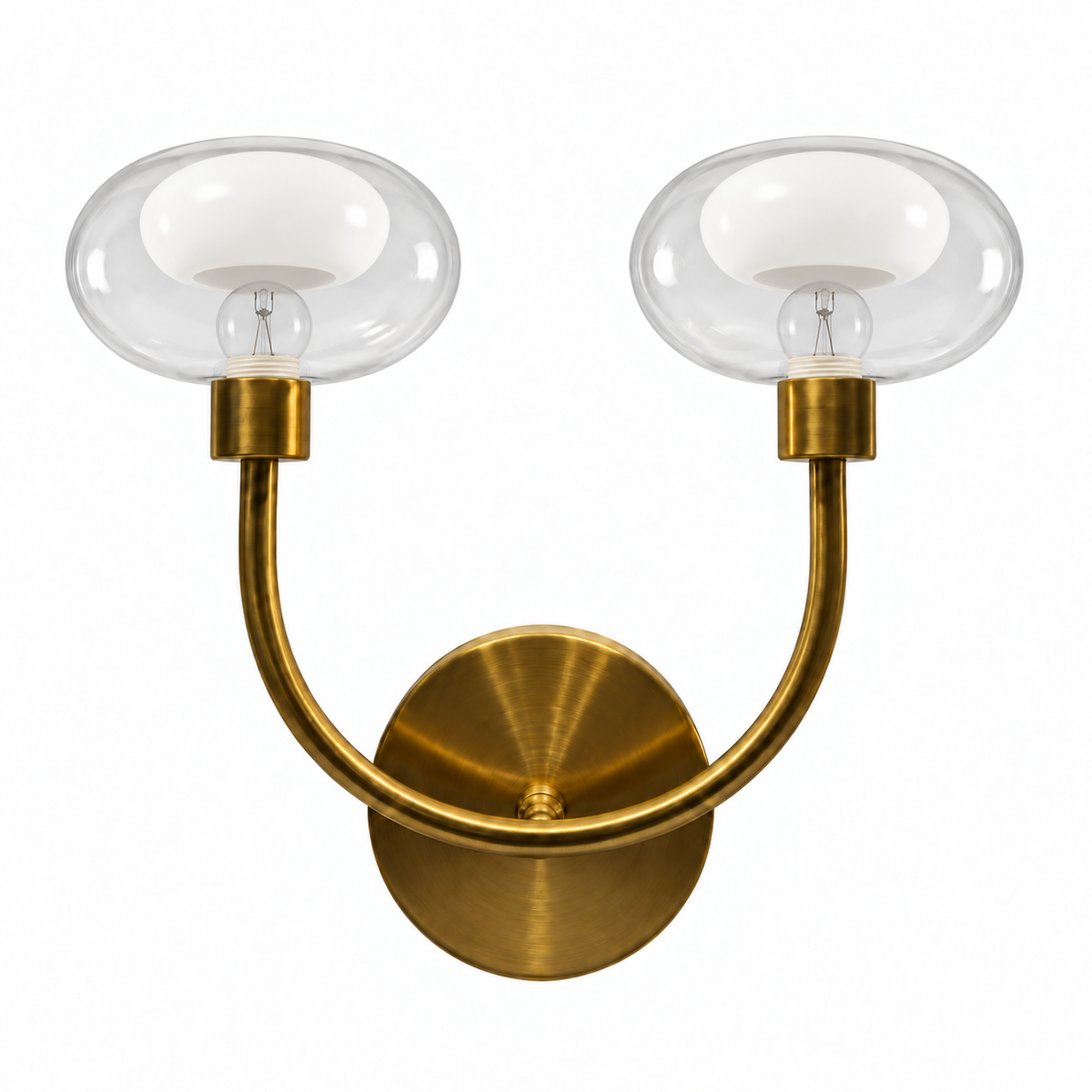 Twin clear rounded shade wall light with white bowl-shaped inner diffusers, a gold-tone U-shaped arm and round wall plate, switched off against a white background