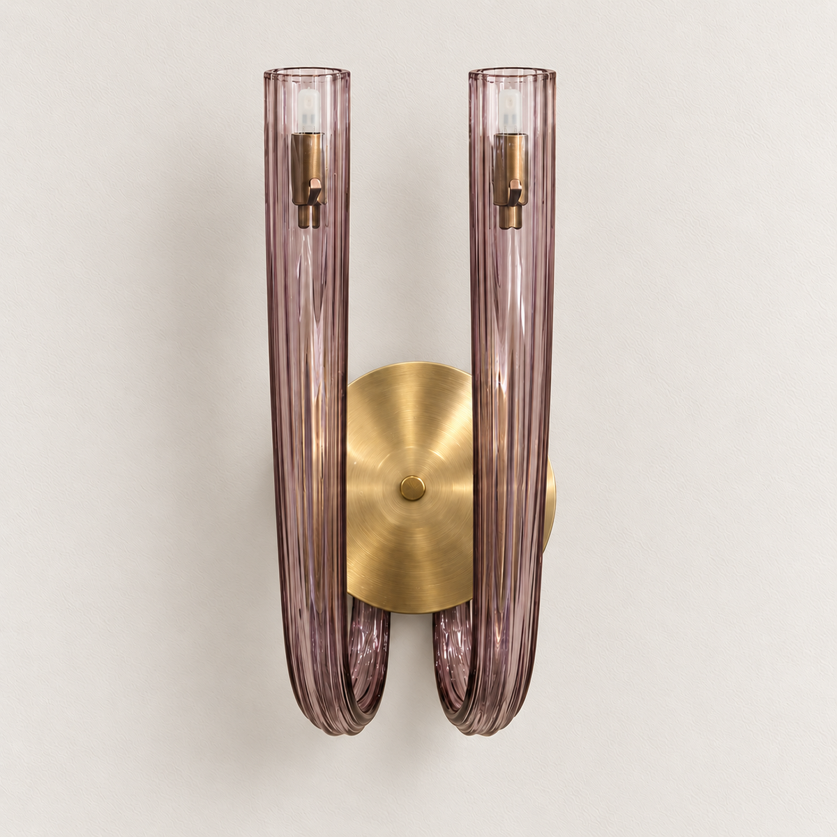 Twin light-purple glass column wall light with rounded lower curves and a circular backplate, switched off