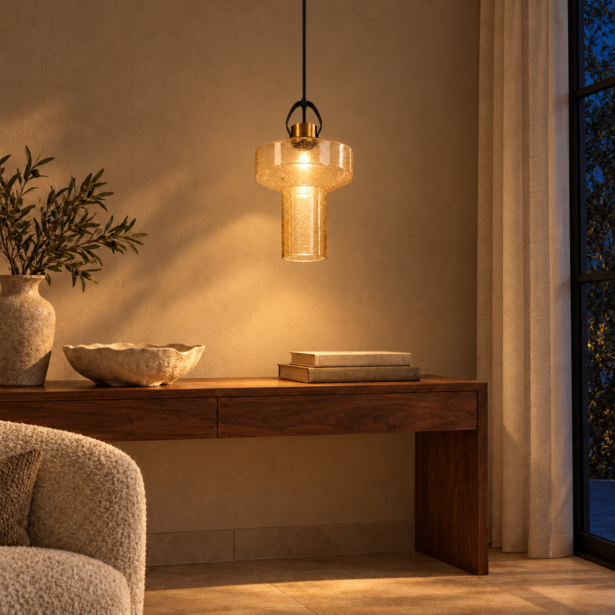 Amber Bubble Glass Drum Pendant, illuminated in a nighttime interior