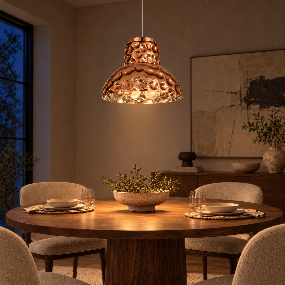 Rose Gold Dimpled Bell Pendant, illuminated in a nighttime interior