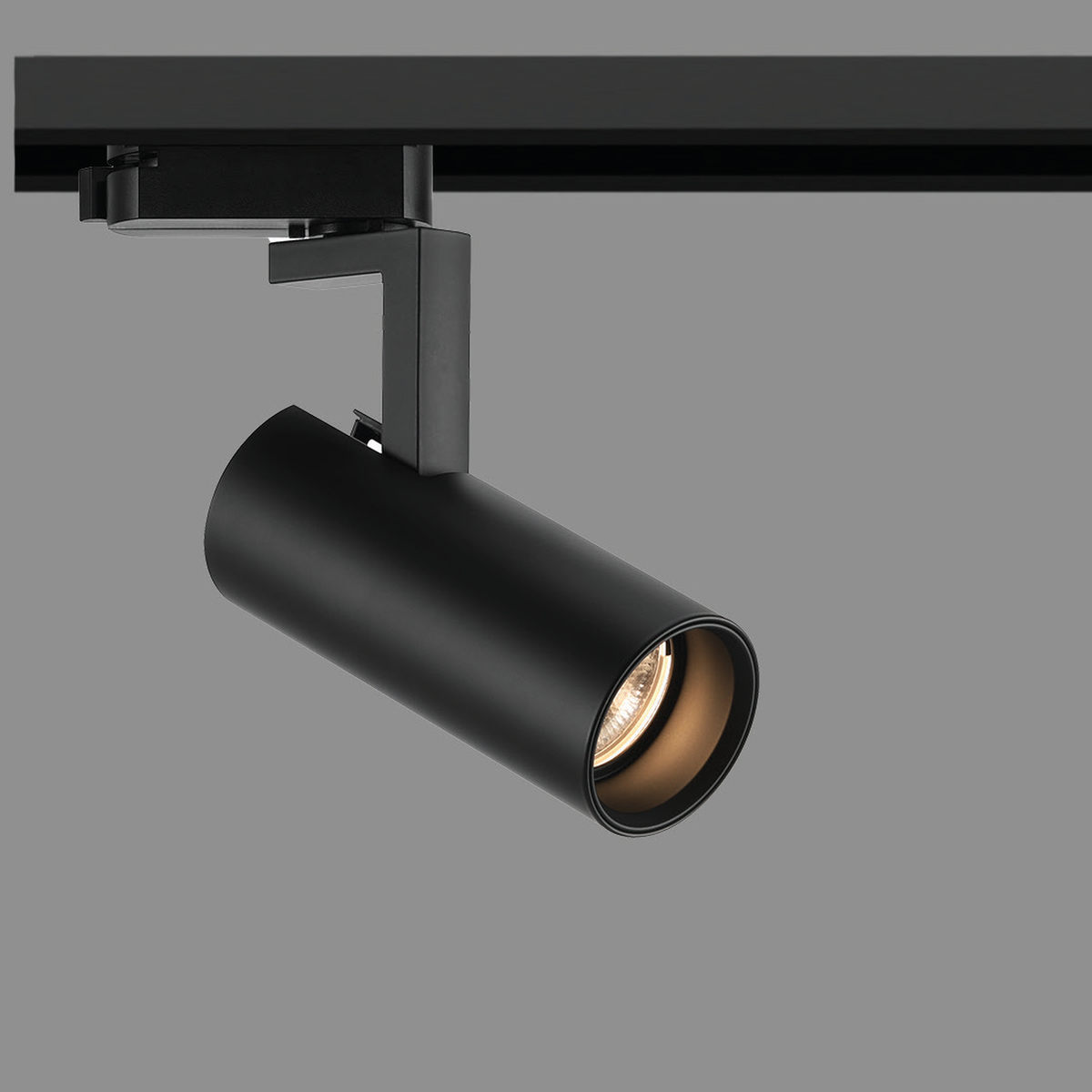 Original VELOX-TRACK black-body family reference with cylindrical spotlight head, pivoting arm and track adapter; pictured wattage and rail inclusion unconfirmed.