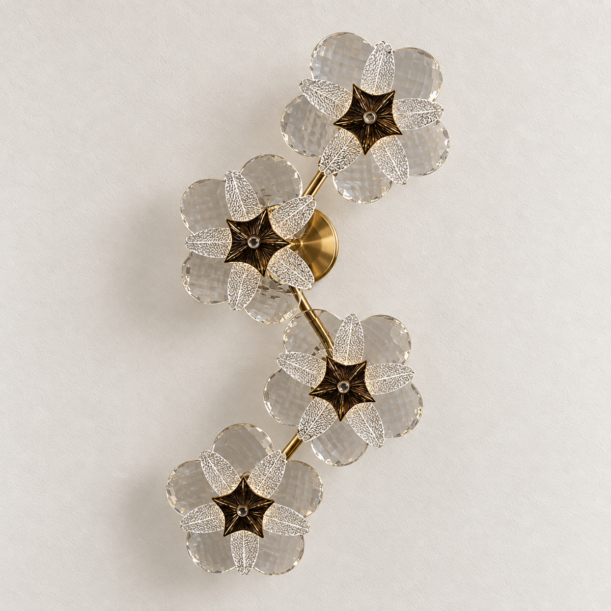 Four-flower crystal wall light with textured clear petals and branching stem, switched off
