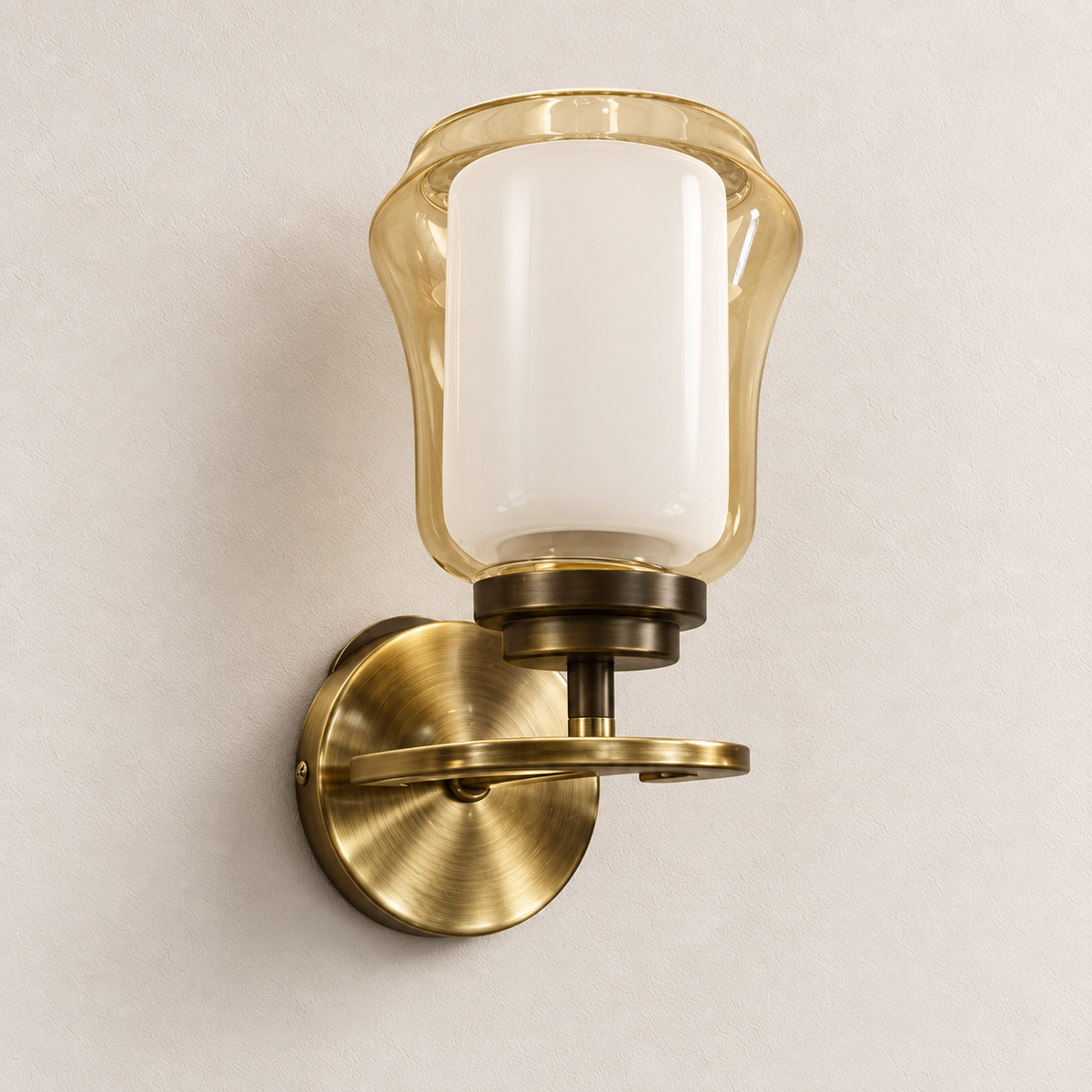 Amber and white glass wall light with round backplate and horizontal ring-arm detail, switched off
