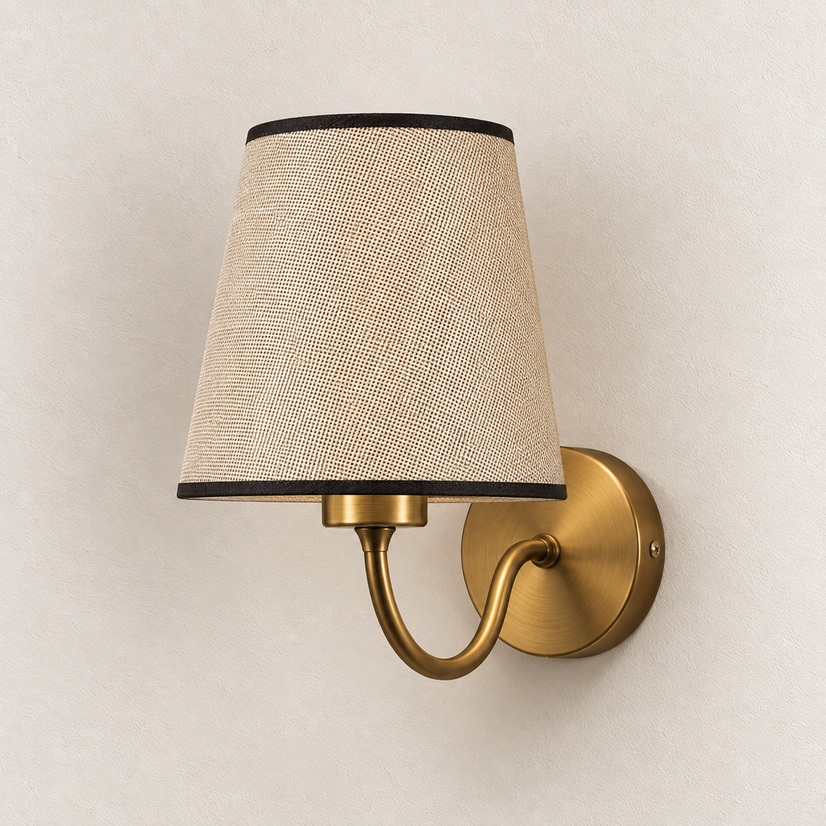 Off-white tapered-shade wall light with dark edging, curved arm and round backplate, switched off