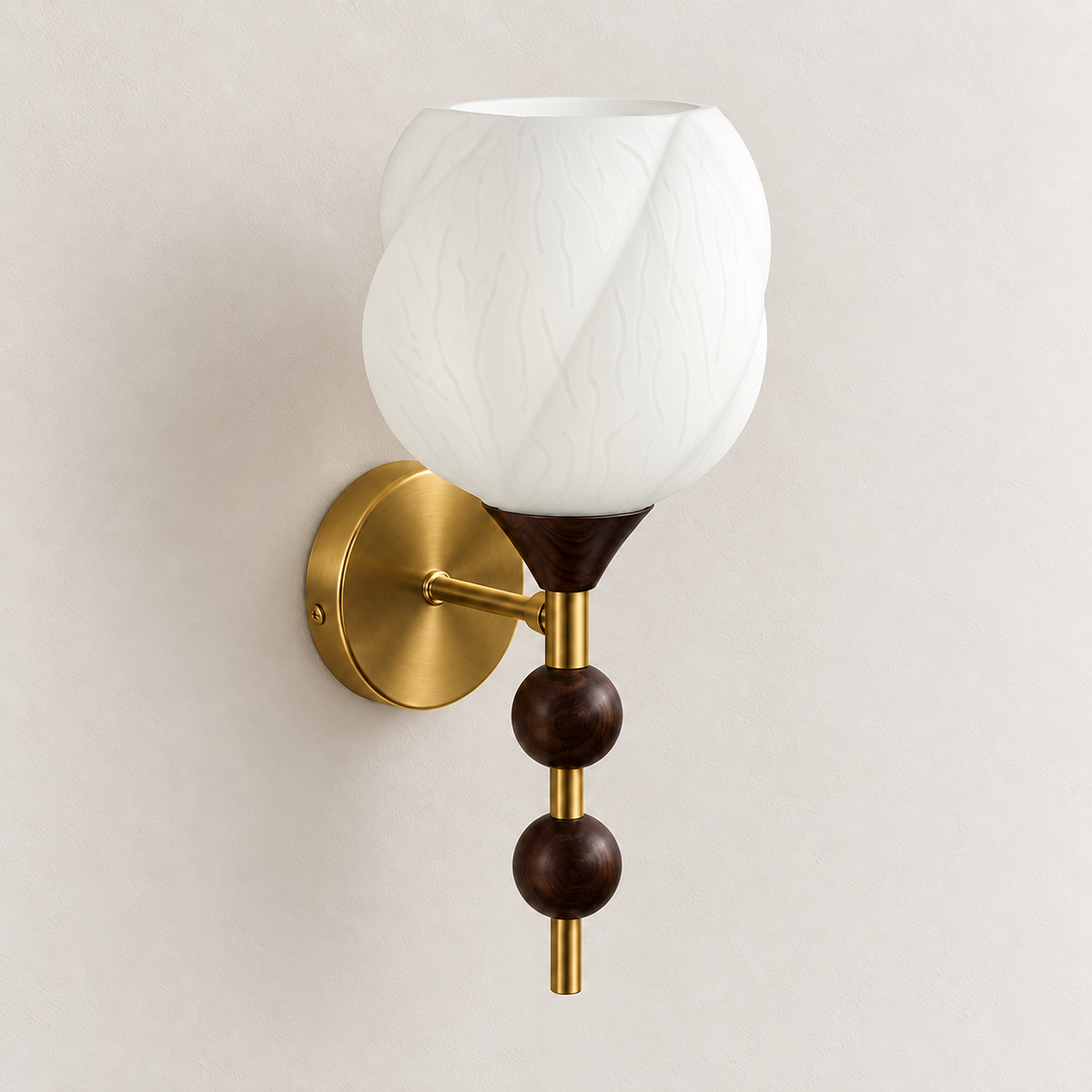 White leaf-textured glass wall light with twin dark beads and a round metallic wall plate, switched off