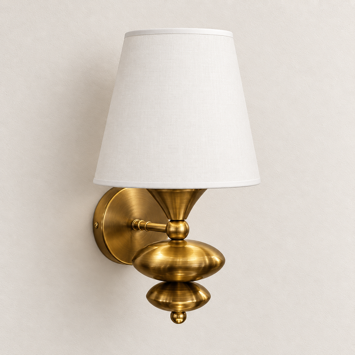 White tapered-shade wall light with sculpted rounded lower body and small finial, switched off