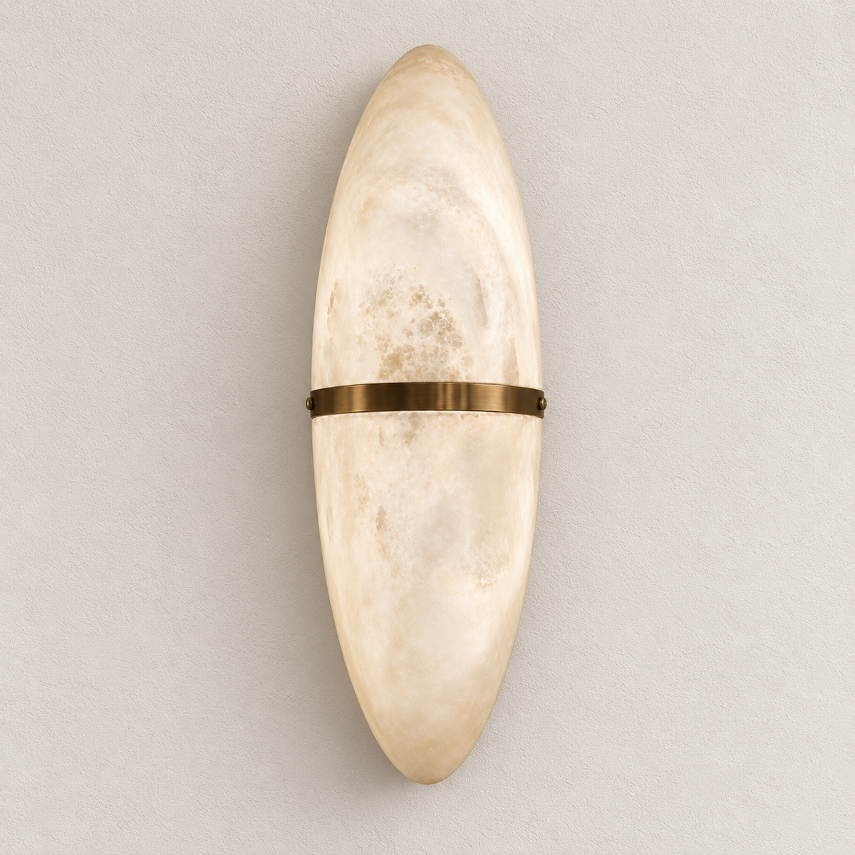 Elongated oval stone-effect wall light with mottled cream surface and slim centre band, switched off