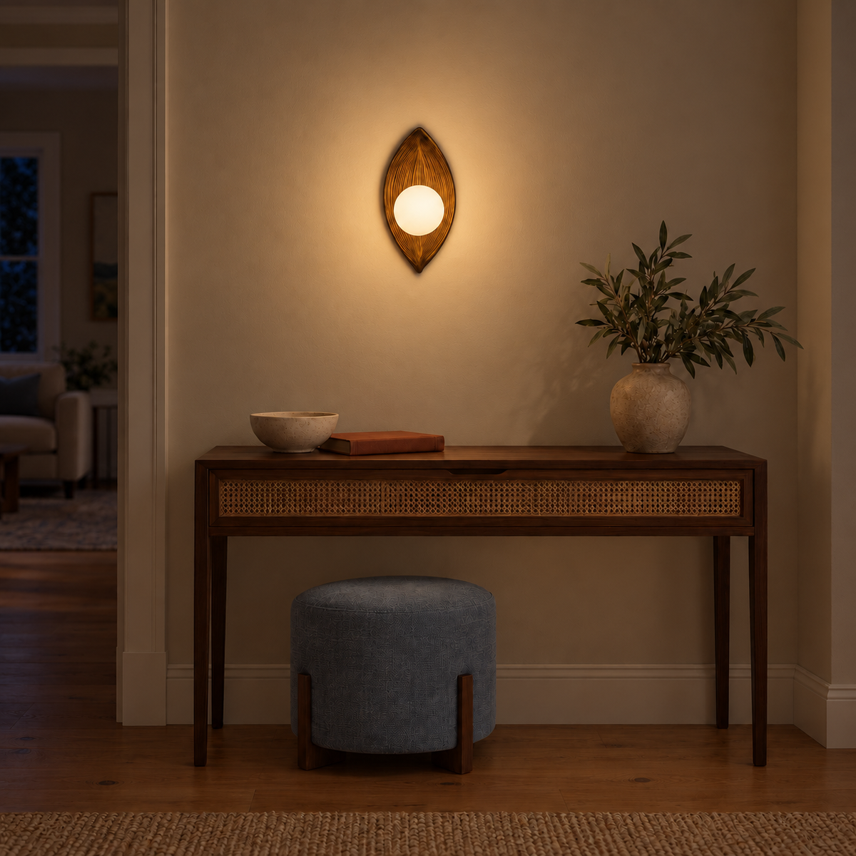 Leaf Relief Globe Wall Light illuminated in a night-time interior