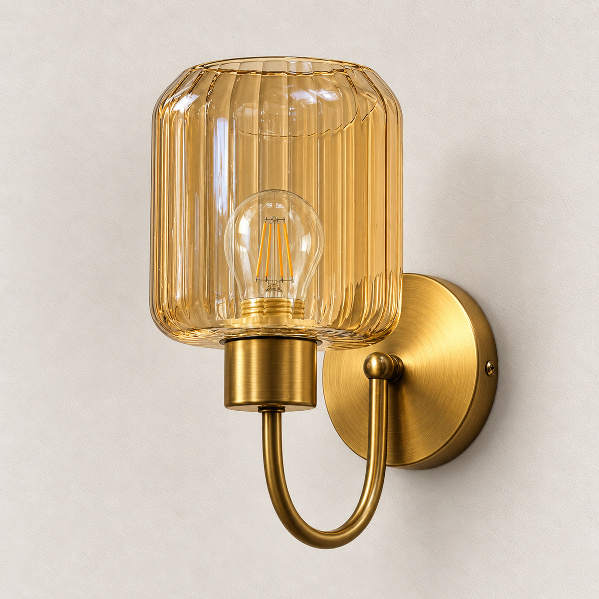 Fluted amber shade wall light with U-shaped arm and round wall plate, switched off