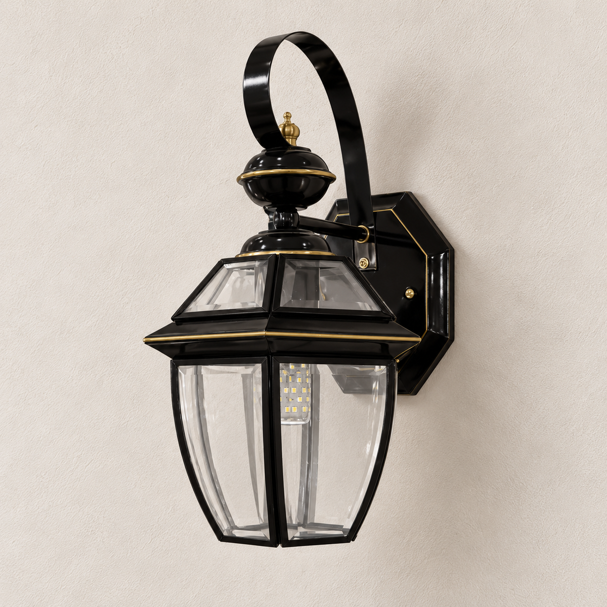 Black Scroll-Arm Clear Glass Lantern Wall Light shown against a neutral background, switched off