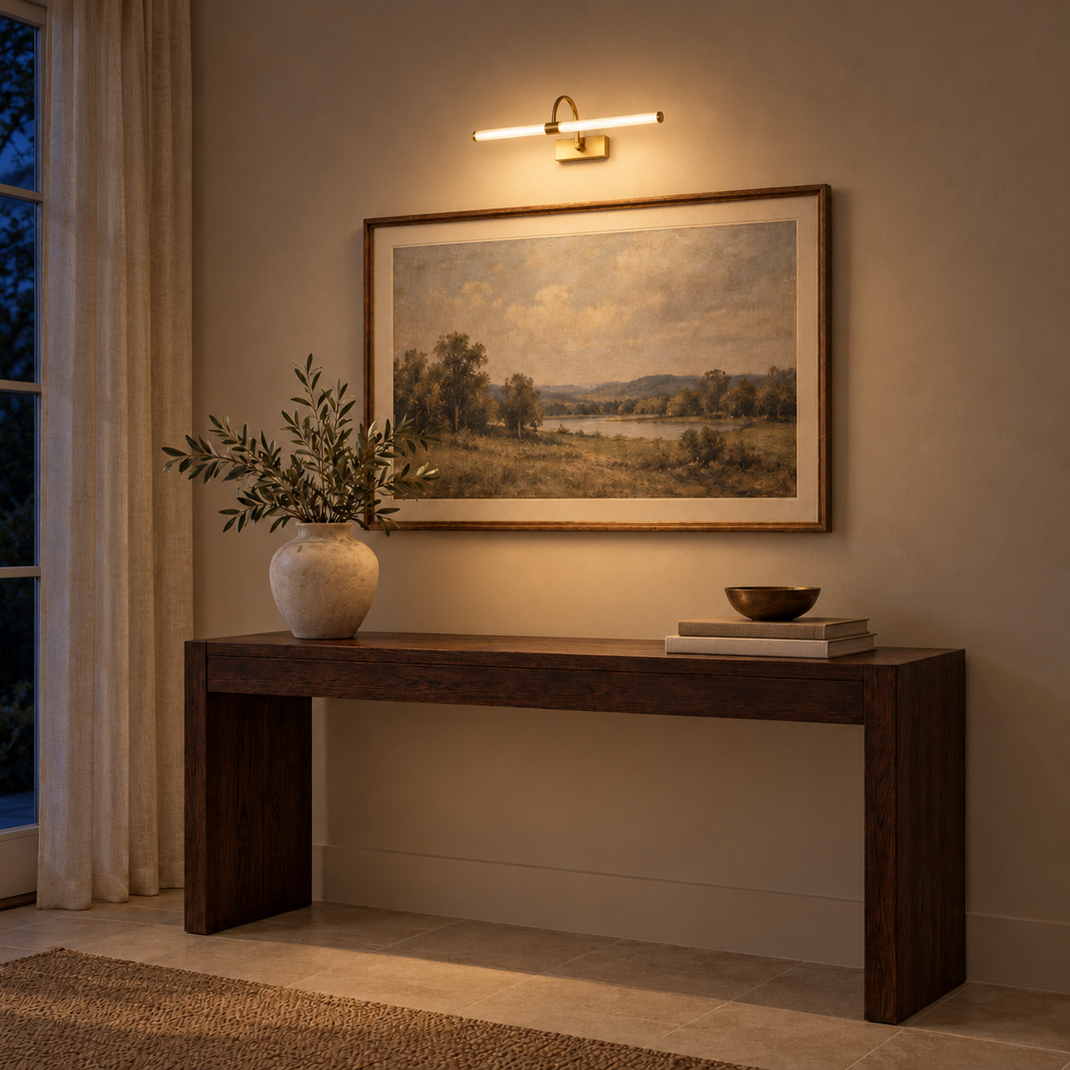 Gold-Toned Arch-Support Tube Picture Light, 410 mm illuminated in the same residential interior at night