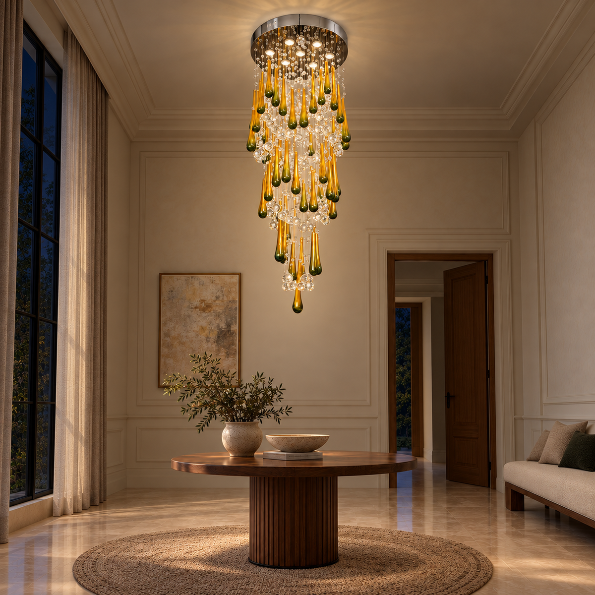 Golden Teardrop Cascade Chandelier — illuminated evening view