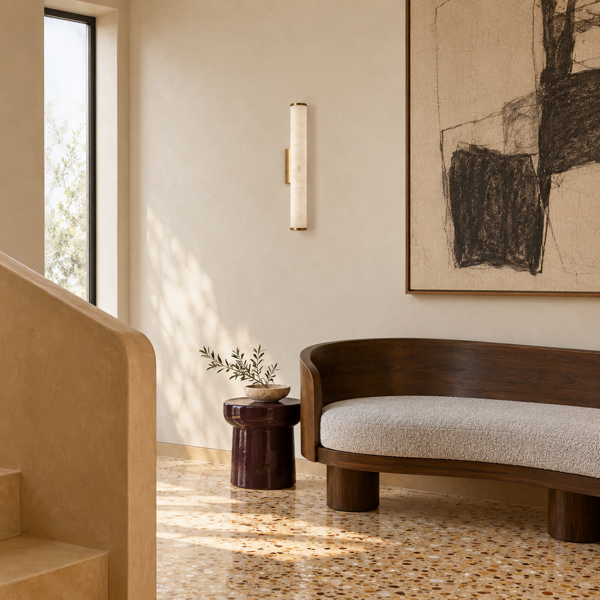 Stone-effect column wall light beside abstract artwork and a curved bench in daylight, switched off