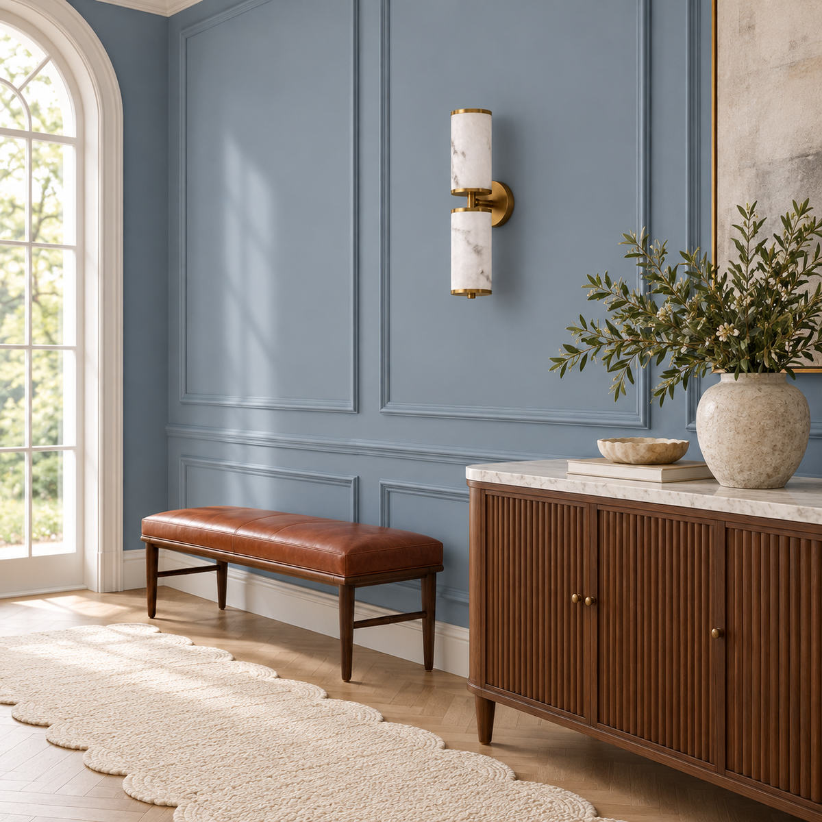Twin stone-effect cylinder wall light above a bench beside a sideboard in daylight, switched off