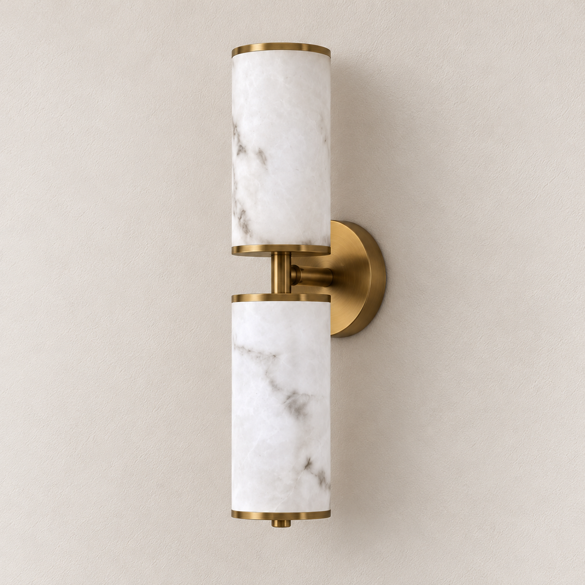 Twin stone-effect cylinder wall light with metallic end caps and a circular backplate, switched off