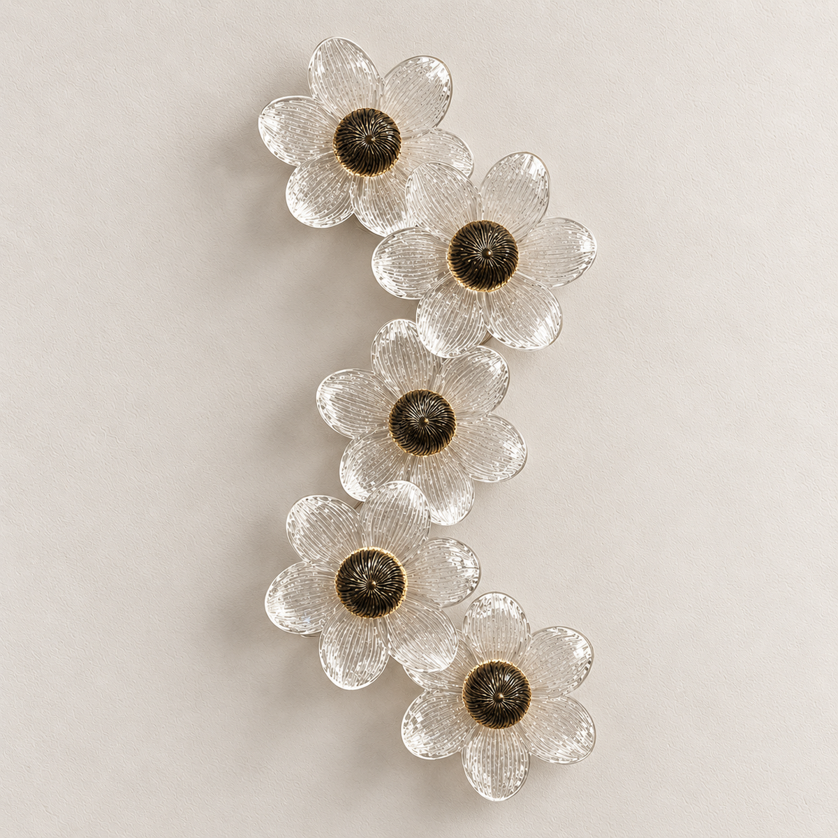 Cascading five-flower clear glass wall light with textured petals and ridged centres, switched off