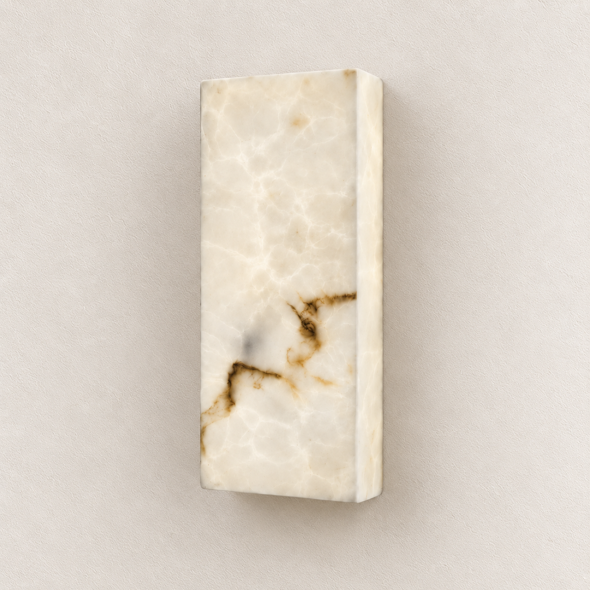 Rectangular marble-effect resin wall light with cream and brown veining against an ivory wall, switched off