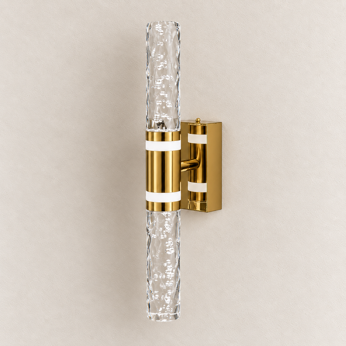 Faceted acrylic double-rod wall light with gold-tone centre and clear bubble-patterned rods, switched off
