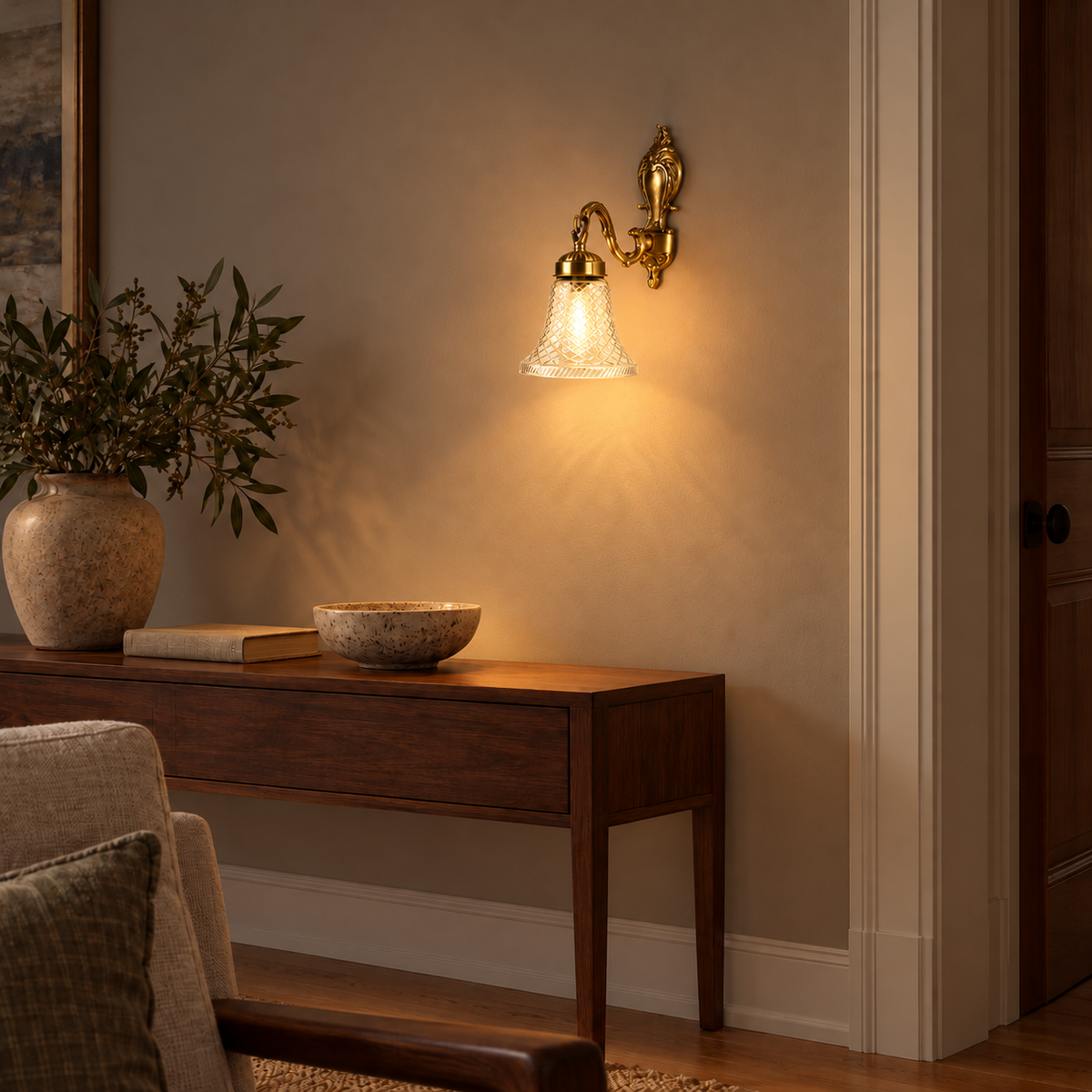 Cut Glass Bell Brass Wall Light, illuminated in a nighttime interior setting.