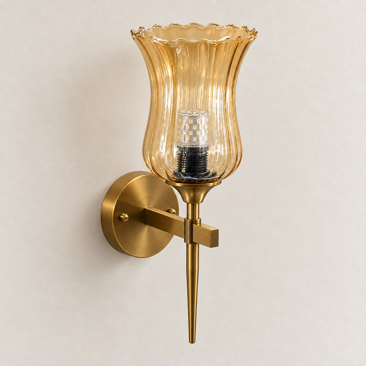 Flared ribbed amber glass wall light with scalloped rim, rectangular bracket and spear-like lower stem, switched off