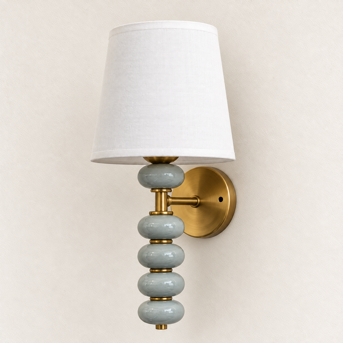 Stacked Ceramic Pebble and White Shade Wall Light shown against a neutral background, switched off