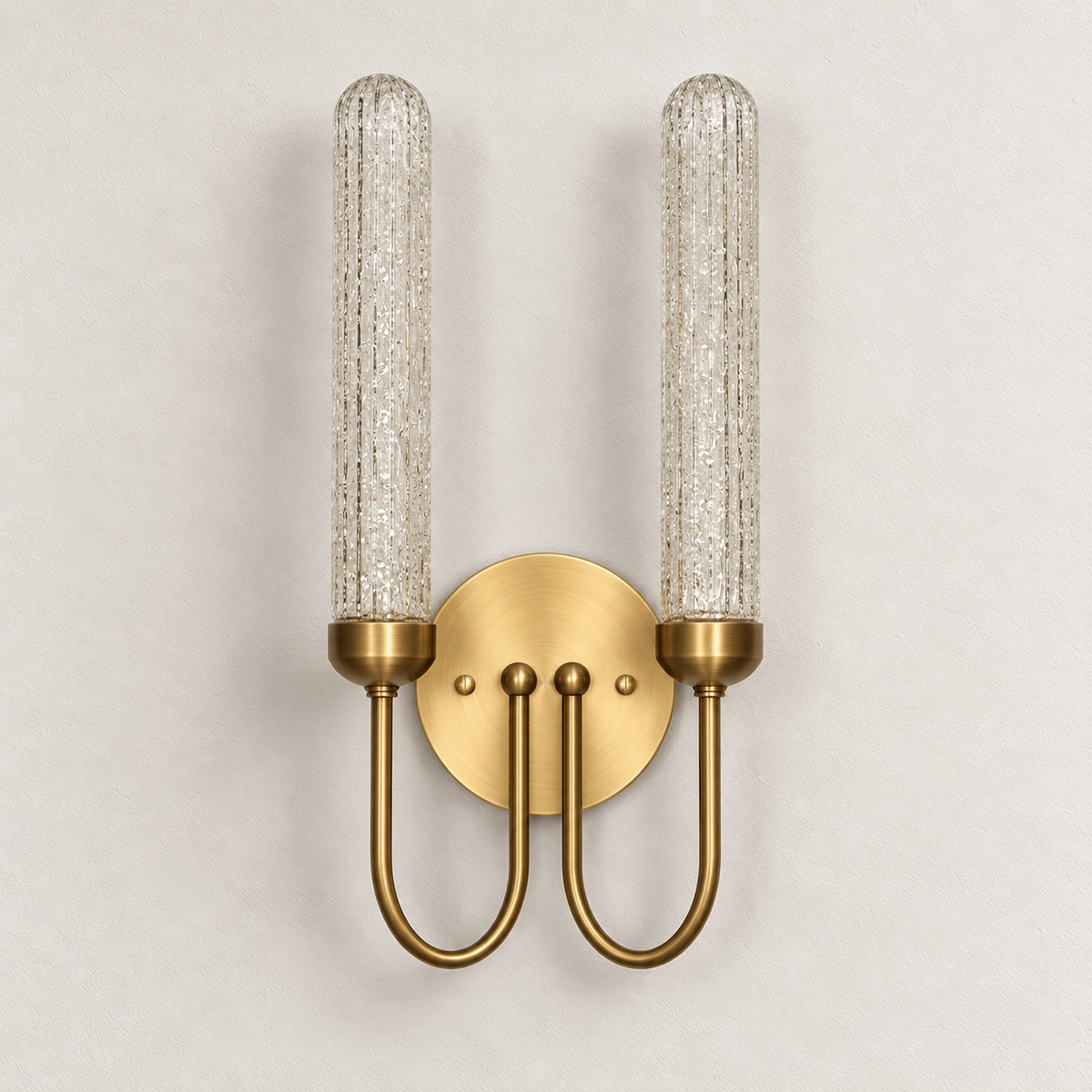 Twin textured glass wall light with rounded cylinders, U-shaped arms and a round backplate, switched off