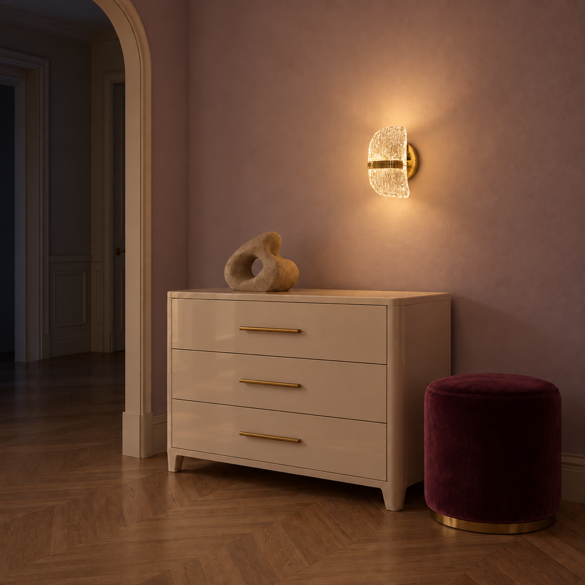 Curved textured acrylic wall light illuminated above a chest of drawers at night