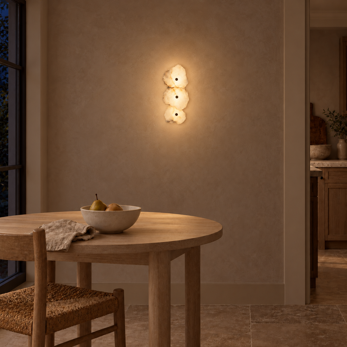 Three-Stone Layered Wall Light illuminated in a night-time interior