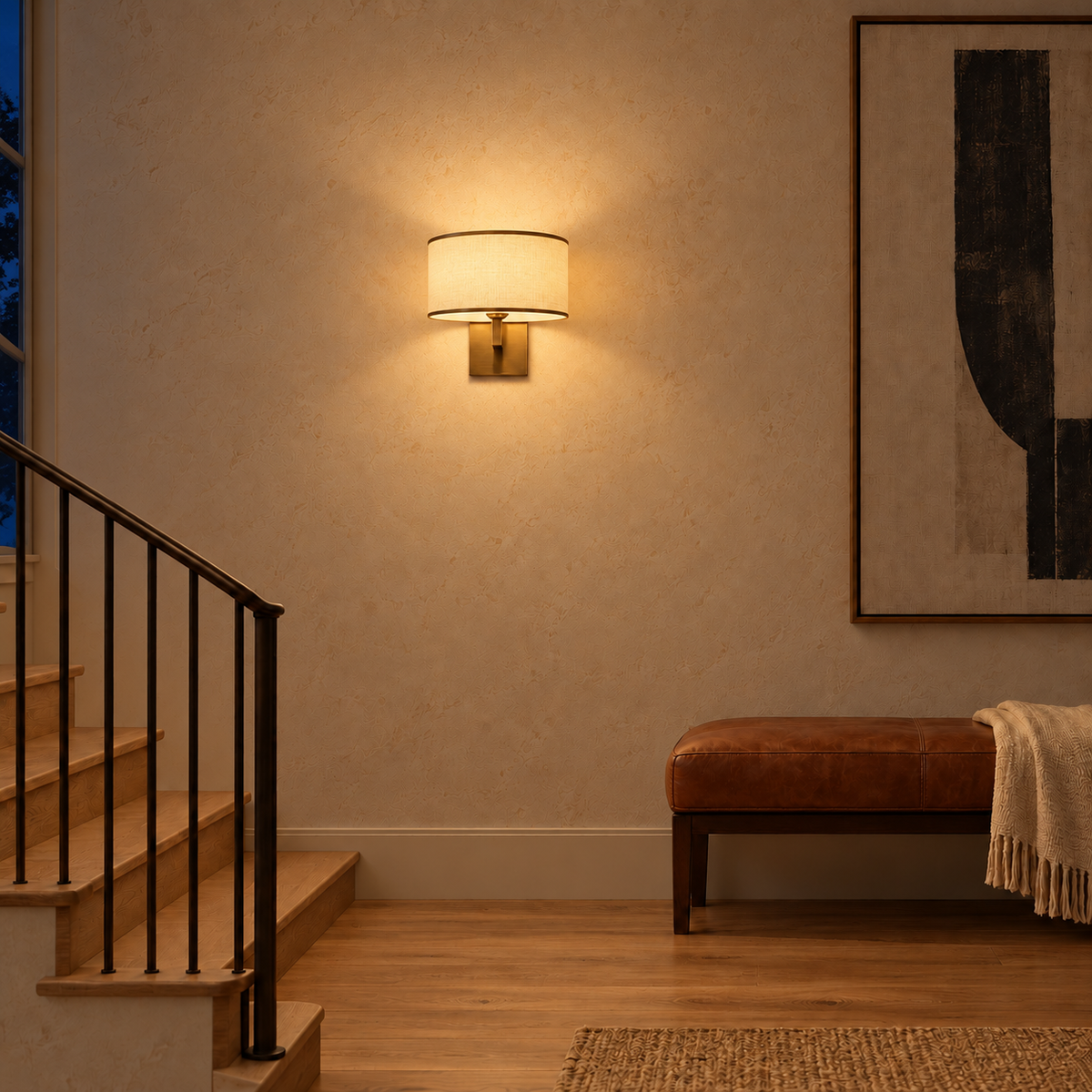 White Drum Shade Square-Backplate Wall Light on a stair-landing wall above a bench illuminated at night