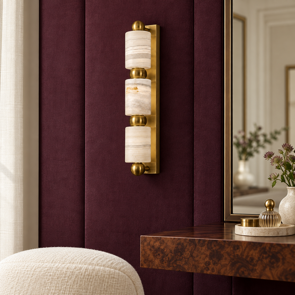 Three-cylinder marble wall light in a refined interior by day