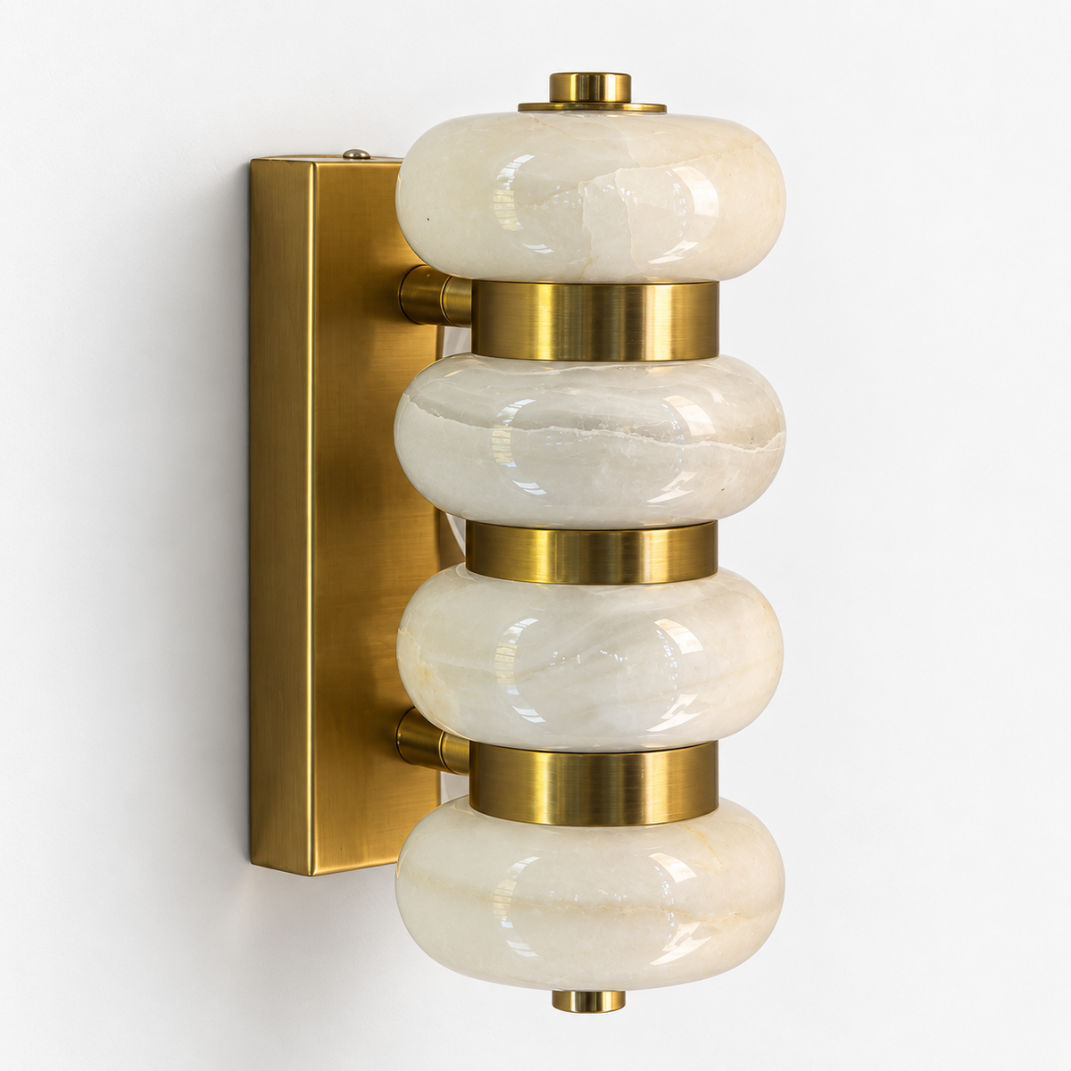 Stacked marble wall light with GAB finish on white background