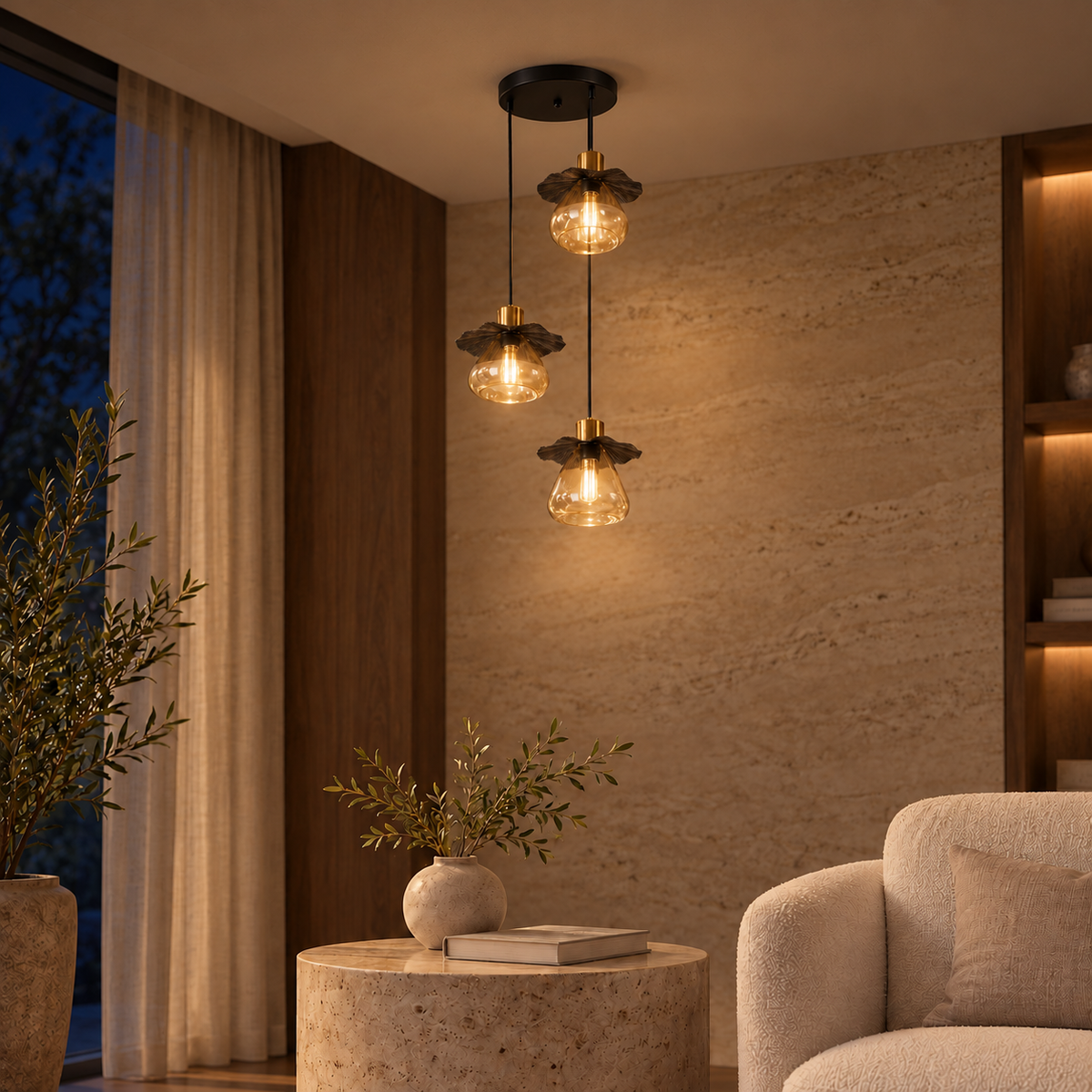 Black & Amber Glass Three-Drop Chandelier, illuminated in a nighttime interior