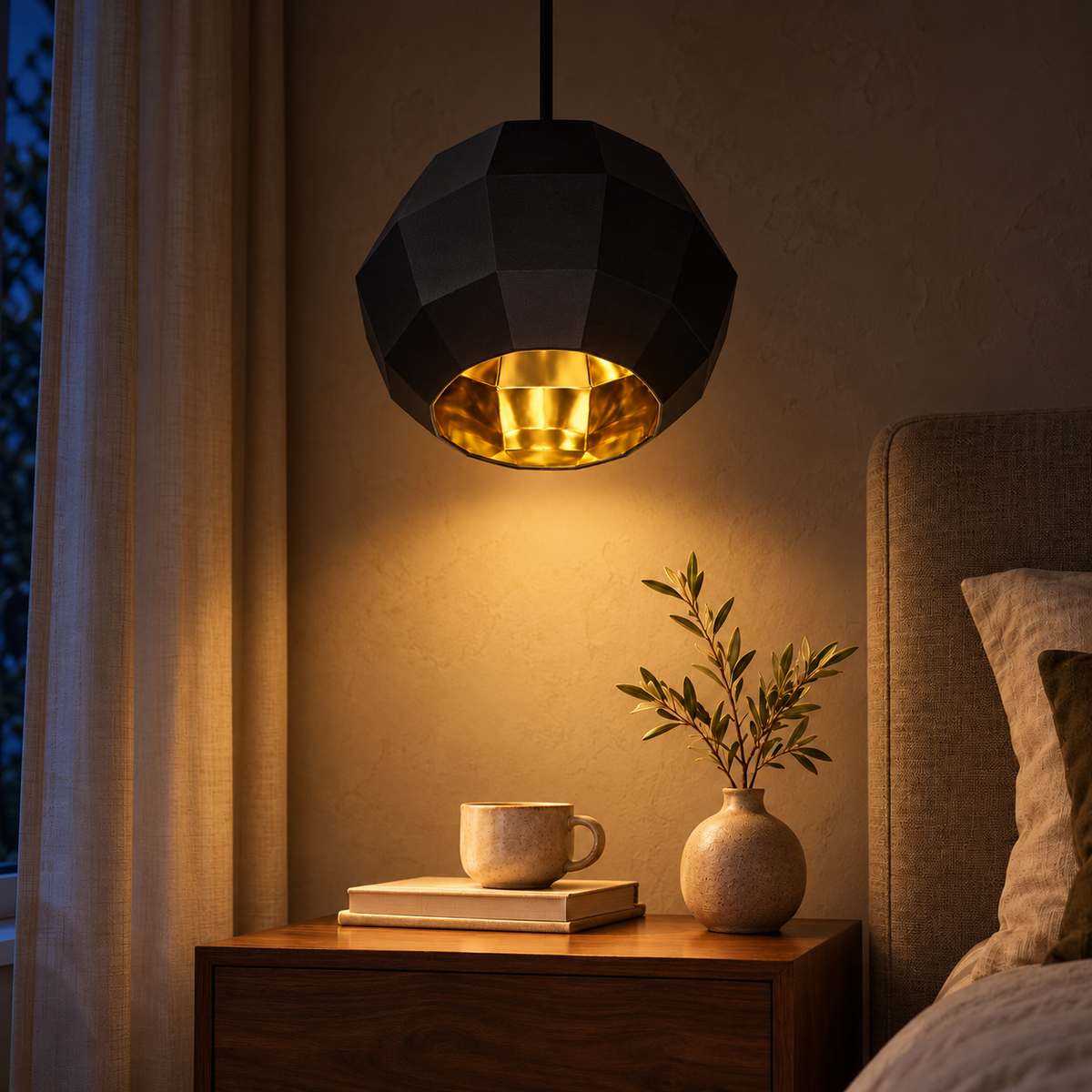 Black & Gold Faceted Pendant, illuminated in a nighttime interior