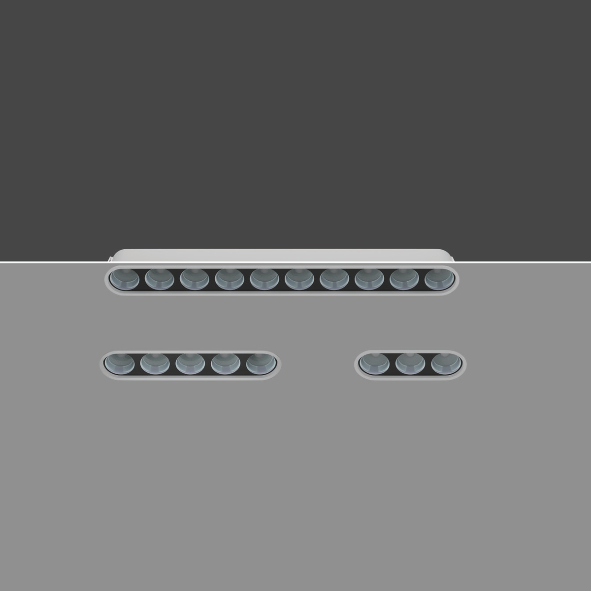 Original OVATE white-body family photograph showing rounded-end optical housings and three fixture lengths; source finish and geometry preserved.