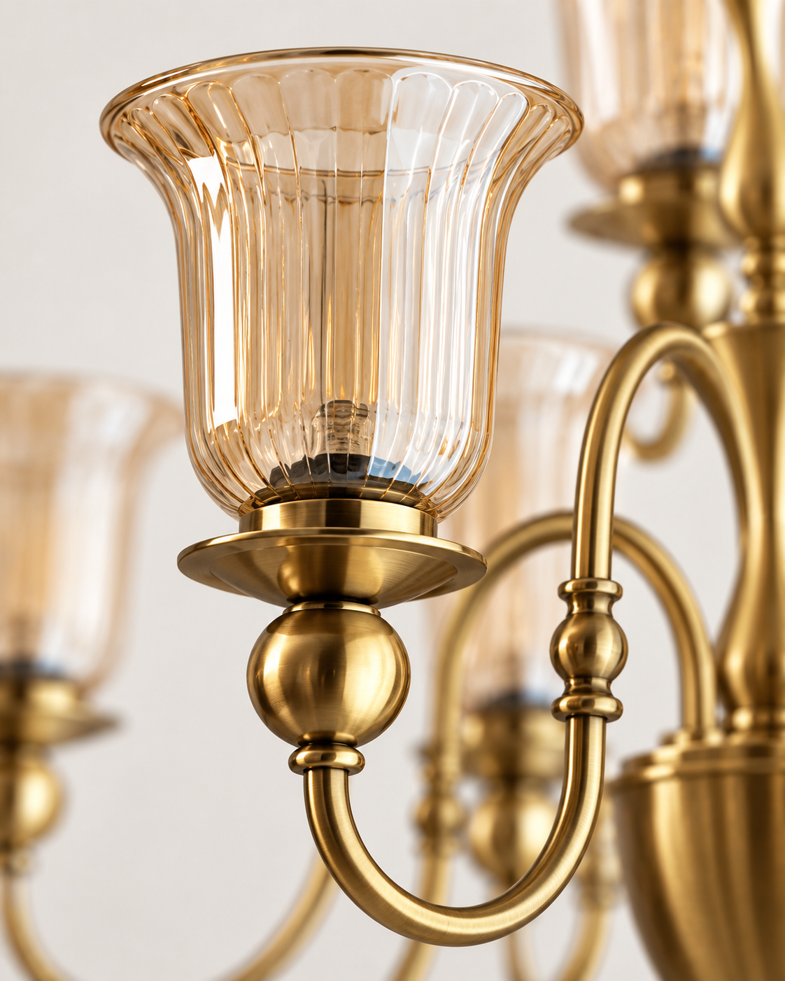 Close-up of fluted glass shade and metal detailing